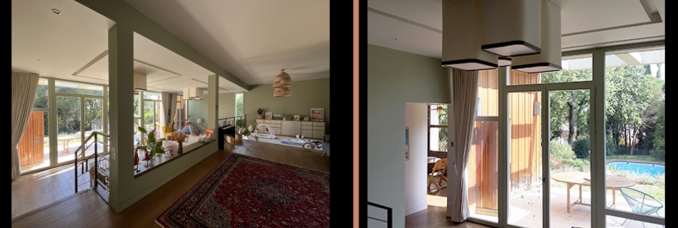 Séjour en double niveau aux murs vert de gris avec mezzanine et tapis persan, ouvert par de grandes baies sur le jardin et la piscine