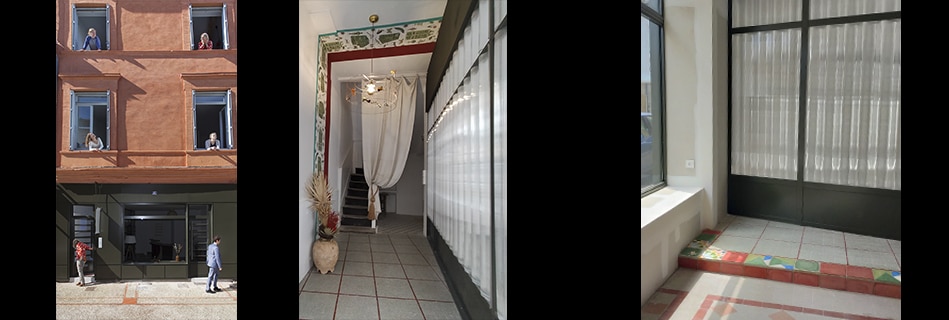 Façade en brique de l'immeuble avec l'agence en rez-de-chaussée, hall d'entrée à l'escalier ancien et pièce voilée de rideaux au sol en tomettes